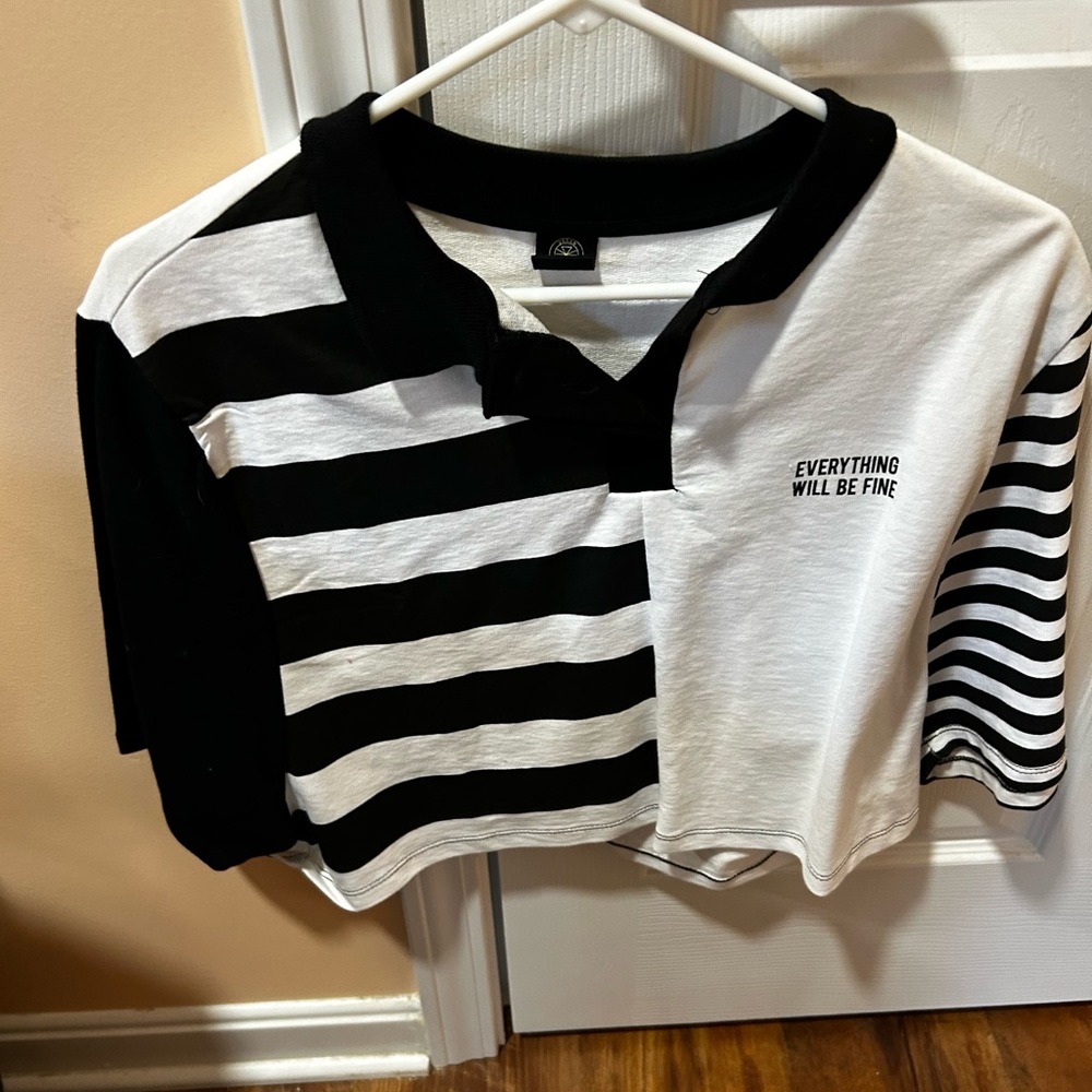 This is a never worn black and white collared shirt from Urban Outfitters